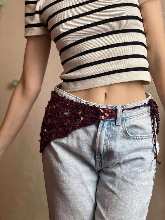 Burgundy sequin crochet hip scarf tied around light-wash jeans